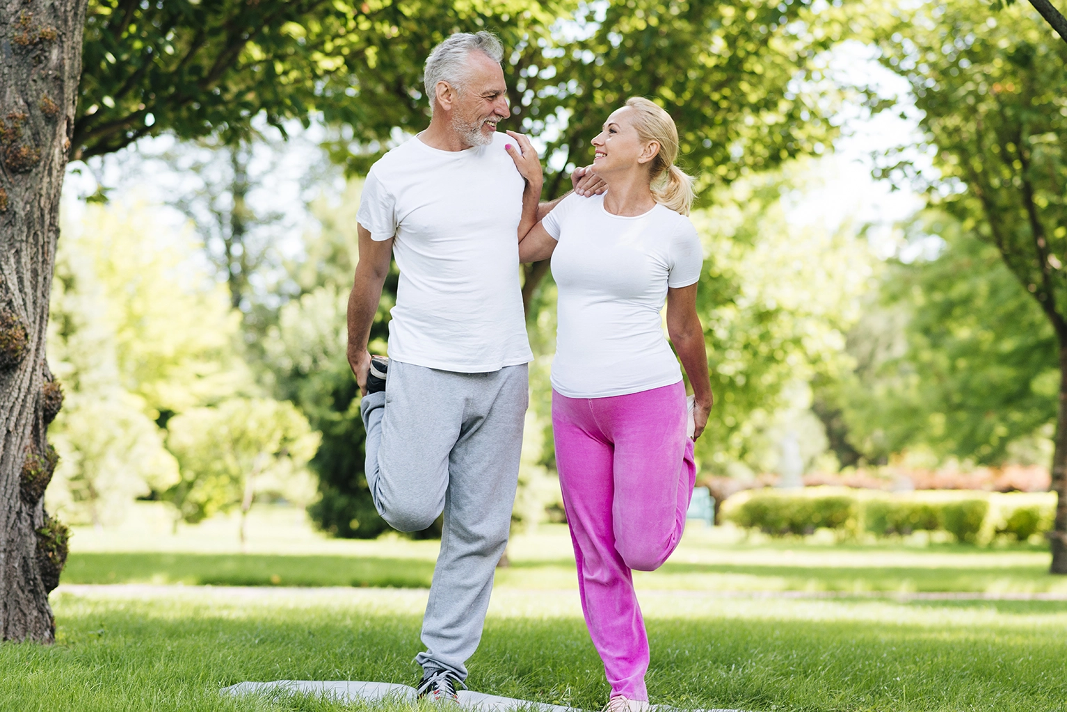 Active senior couple walking in a park — neutral editorial lifestyle image
